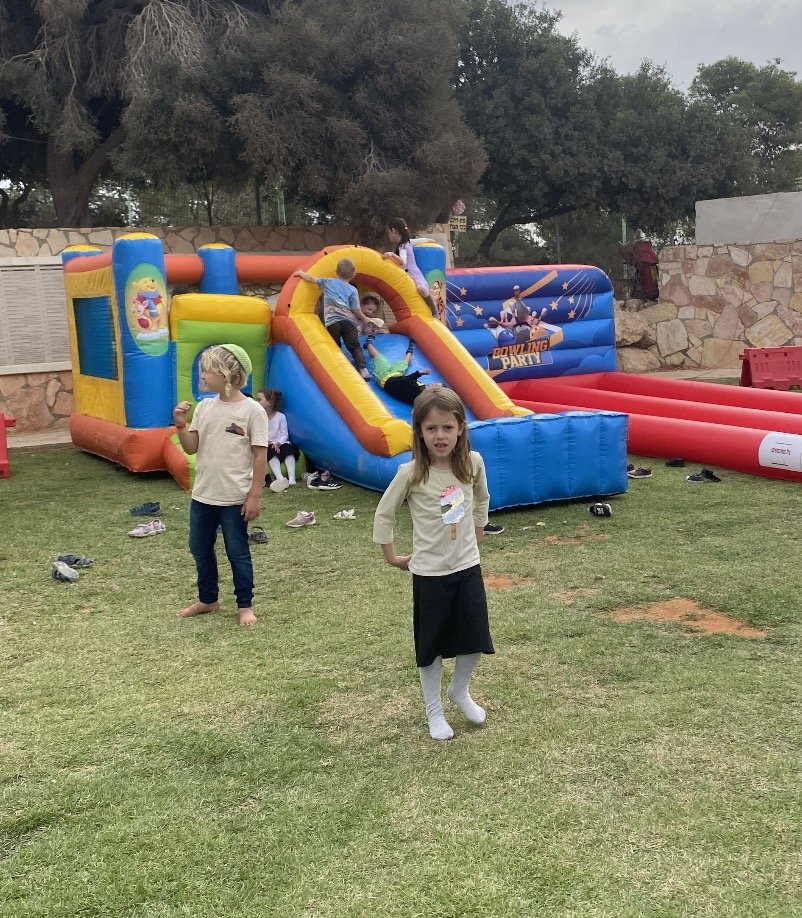 Children on the bouncy castle and slide